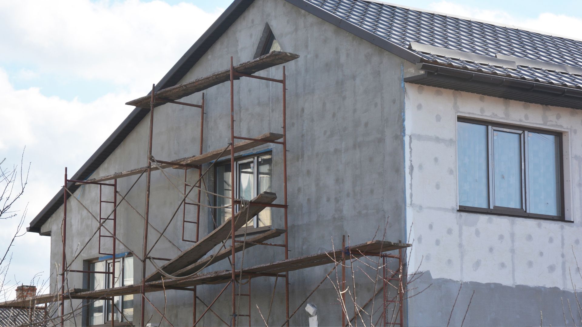 A house under construction with scaffolding around it