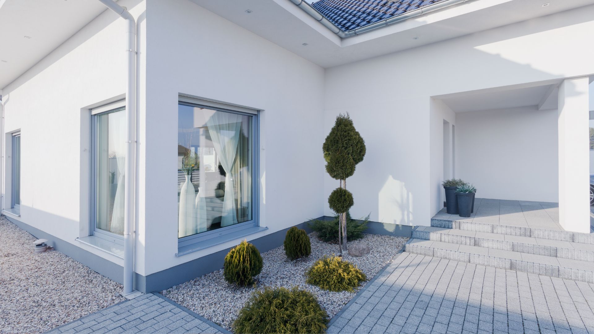 A white house with a skylight on the roof