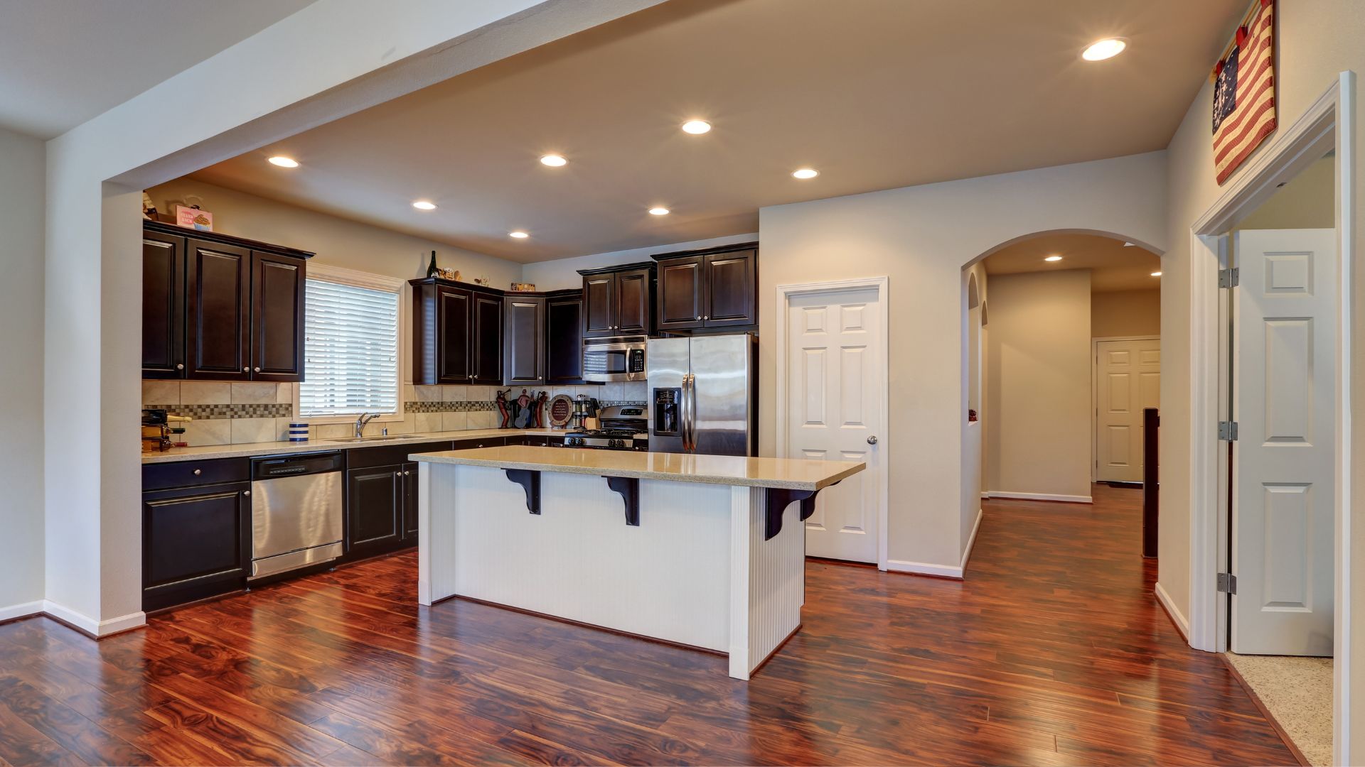 A large kitchen with a center island in the middle of the room