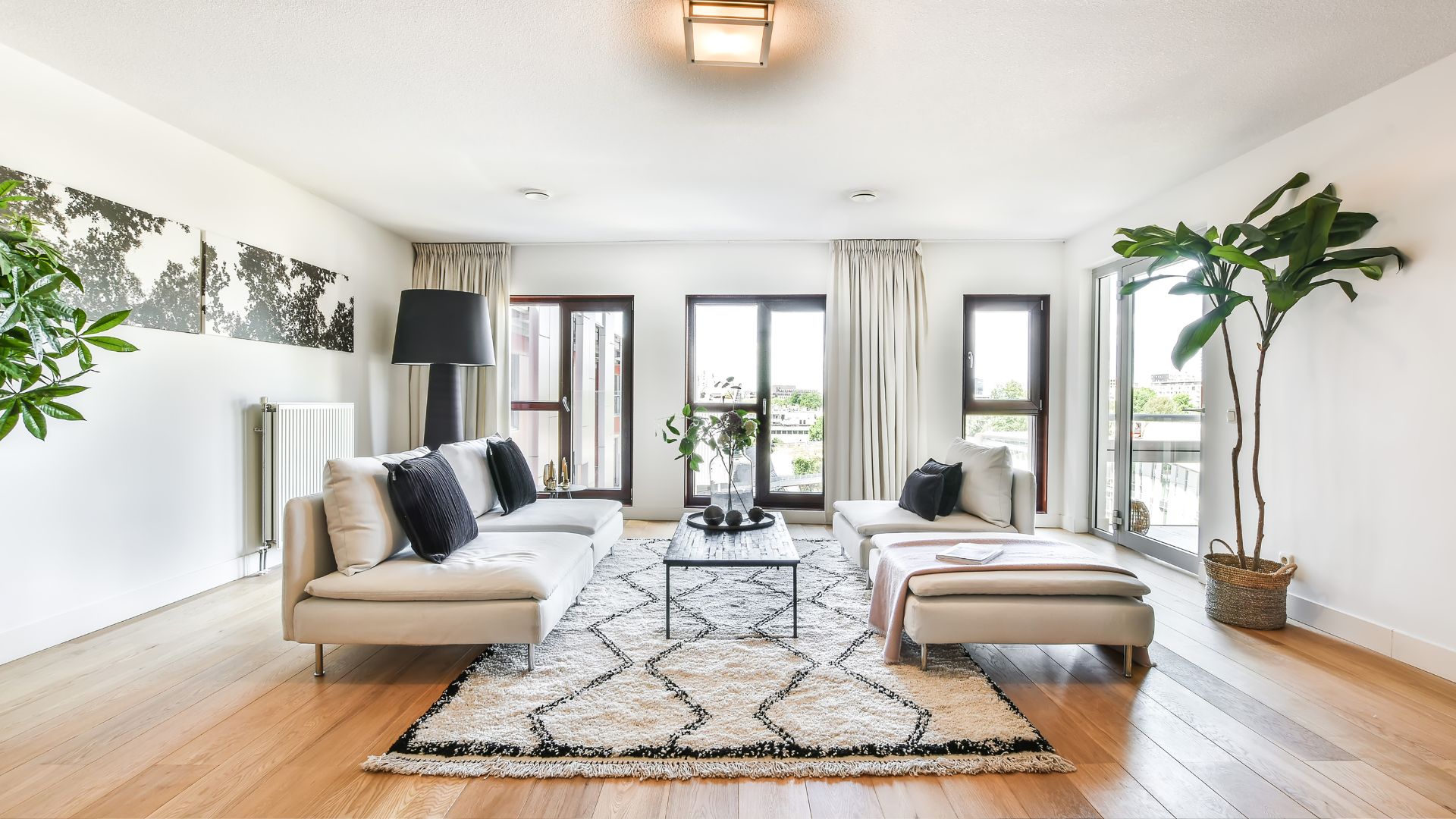 A living room filled with furniture and a large window