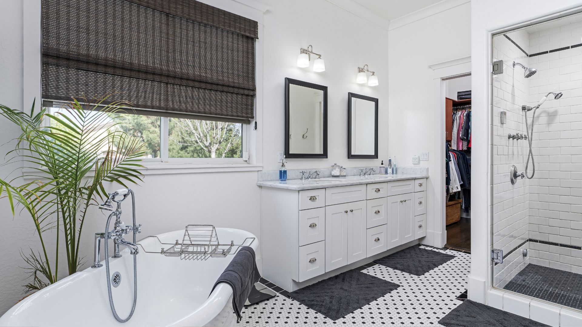 A white bathroom with a black and white checkered floor