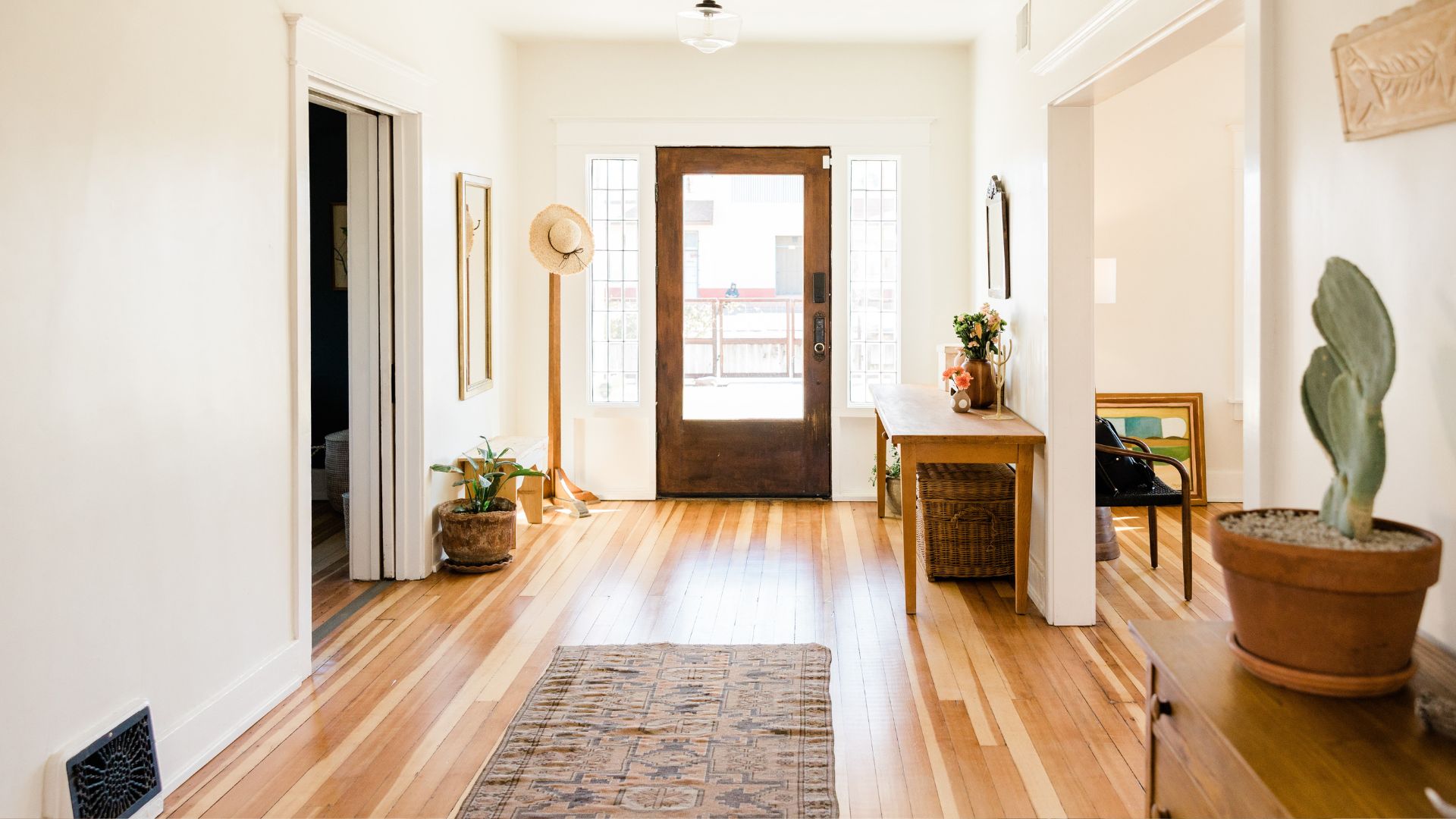 A hallway with a wooden floor and a door