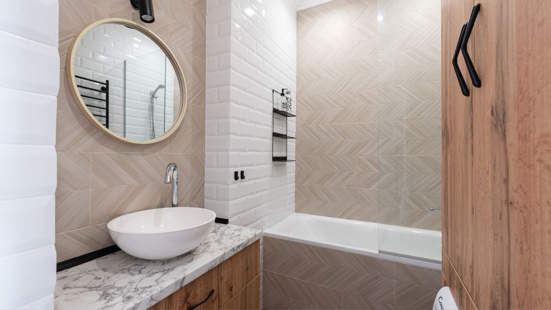 A bathroom with a sink, mirror and bathtub