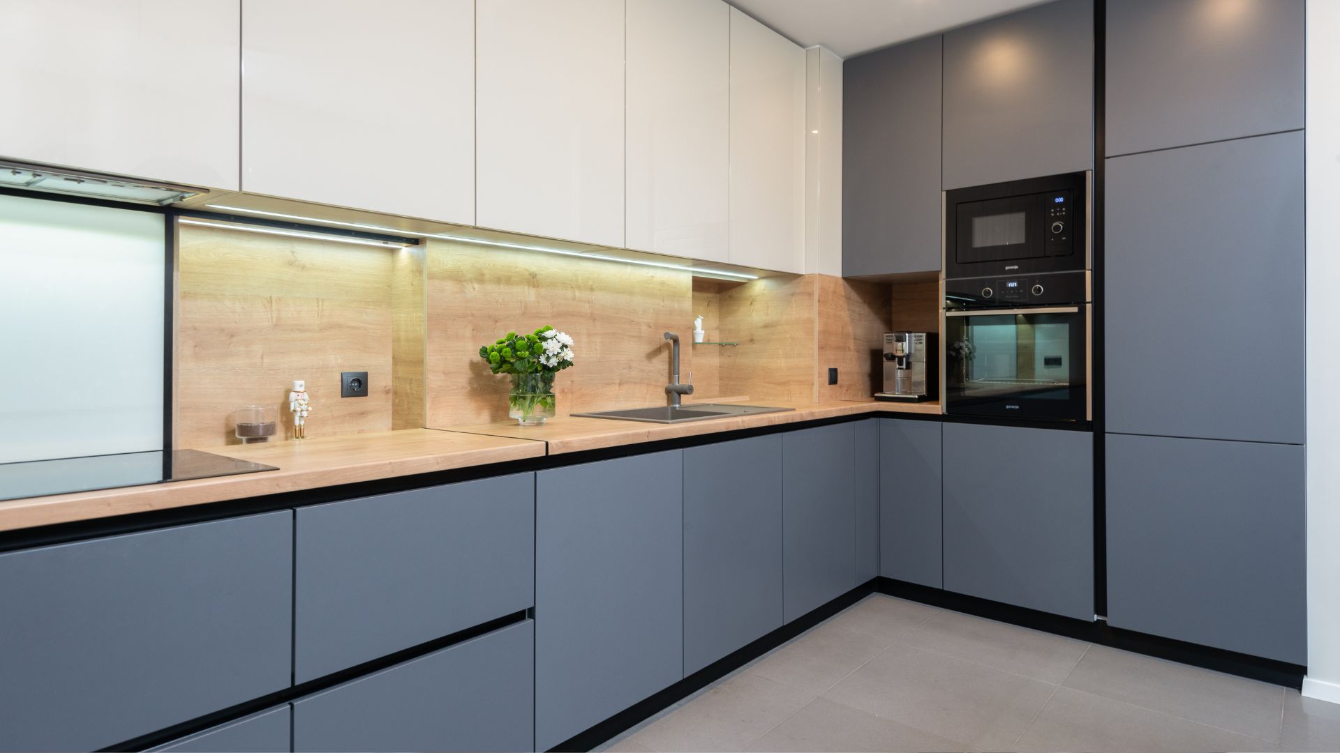 A kitchen with a sink and a microwave